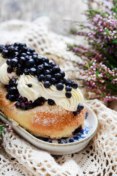 Delicious sweet yeast bun filled with smooth custard cream and topped with fresh blueberries.