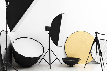 Different modern lighting equipment and tripod in photo studio © New Africa