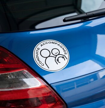 Accompanied Driving Sign on Rear of Car