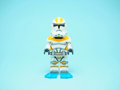 Indonesia - October 30, 2024 : Mini toy of action figure at table with blurred background. Miniature photography concept design. Minifigure of Stormtrooper character from Star Wars film.