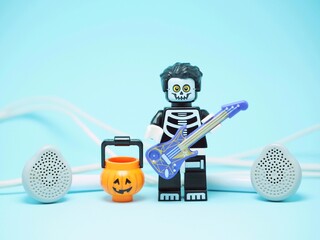 Fototapeta premium Indonesia - September 8, 2023 : Mini toy of action figure at table with blurred background. Miniature photography concept design. Halloween party costume.