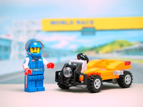 Indonesia - August 16, 2023 : Mini toy at table with blurred background. Racing car concept design.