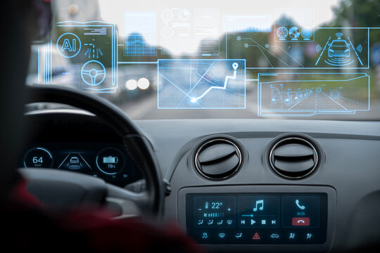 AI-powered autopilot detects vehicles, pedestrians, traffic lights and road signs while driving through a busy city street. Computer vision for analyze urban traffic, passengers relax inside the car