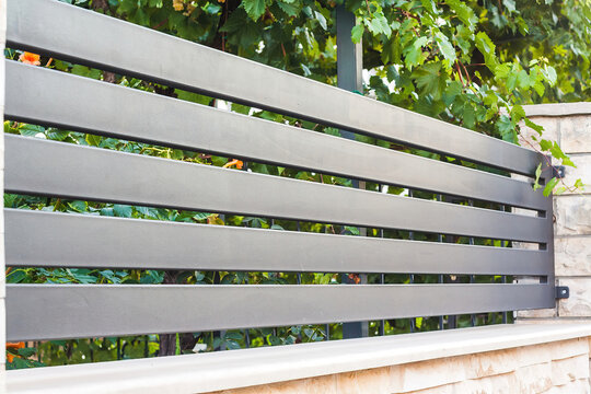 Modern fence with aluminum or metal shutter
