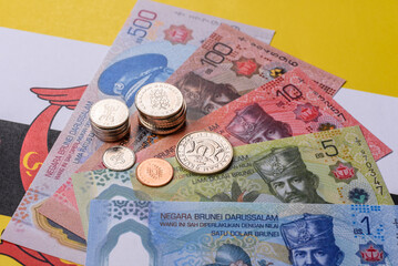 Brunei paper money, dollar banknotes and sen coins as currency for exchange or travel. Brunei money © chernikovatv
