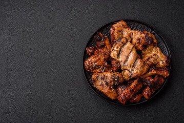 Grilled meat set featuring chicken breast, wings, and ribs seasoned with spices. Grilled meat set