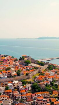 Vertical video. Kavala, Greece. Kavala Fortress. Historic city center. Aegean Sea. Summer. Drone footage, Point of interest. Rich colors