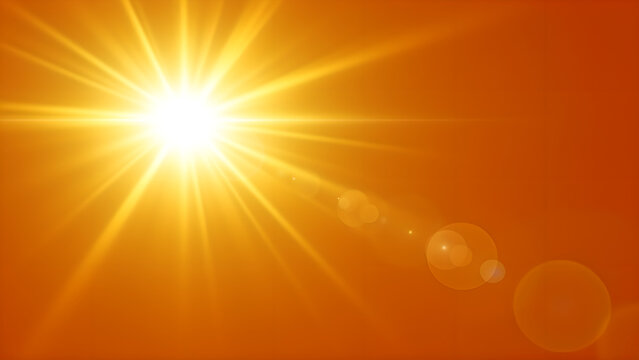 Bright glowing sun shining in a vibrant orange sky background.