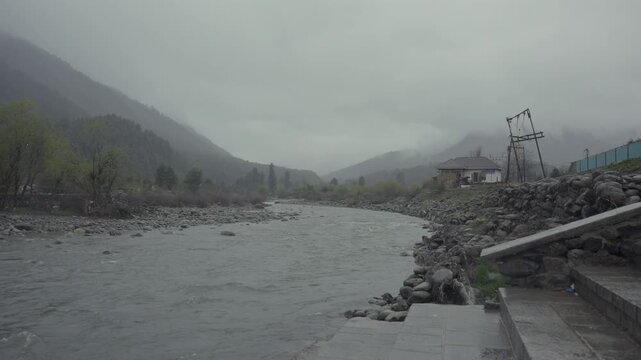 A Shot of Pahalgam Lidder River and Misty Himalayan Mountains Jammu and Kashmir India