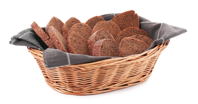 Slices of fresh bread in wicker basket isolated on white