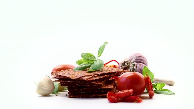 Homemade tomato snack with garlic and tomatoes on white background