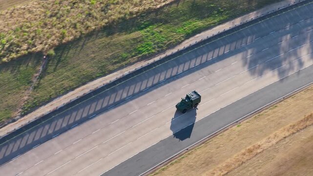 Military Vehicle Testing on a Sunny Track