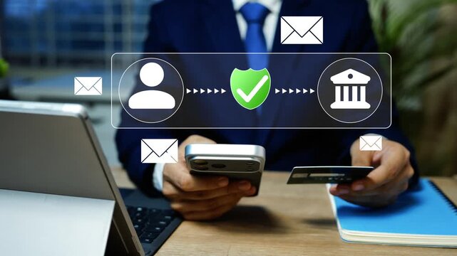 Holographic Secure mobile banking and online payment, Businessman using smartphone and credit card for secure online banking, with email, user, shield and bank icons over laptop in a modern office