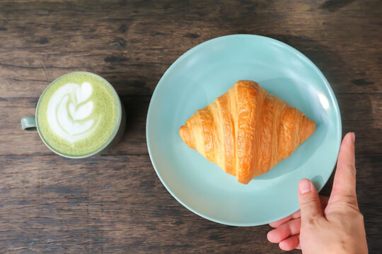 croissant , French croissant or French bread and green tea or matcha green tea, milk green tea or matcha latte or matcha green tea latte