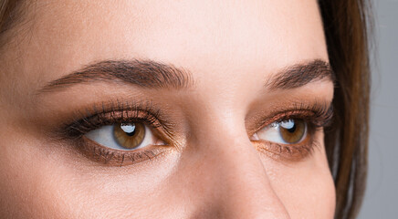 Fototapeta premium Woman with beautiful makeup, closeup. Eye shadow product