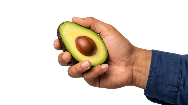 Side grip cradling an avocado half sideways displaying its buttery flesh and large round seed featured as a PNG isolated on transparent background