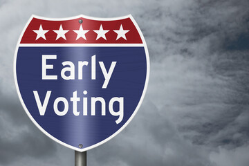 Early Voting text on an American interstate road sign with stormy sky for voting © Karen Roach