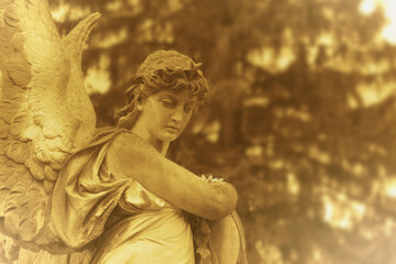 Fototapeta premium Angel of Death statue as a symbol of grief, mourning and remembrance of a deceased person. Copy space for text or design.