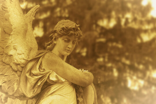 Angel of Death statue as a symbol of grief, mourning and remembrance of a deceased person. Copy space for text or design.