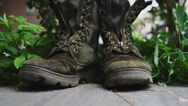 Worn Taiwanese Military Boots on Grass with Weathered Texture