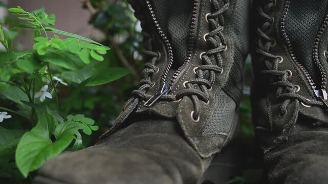 Worn Taiwanese Military Boots on Grass with Weathered Texture