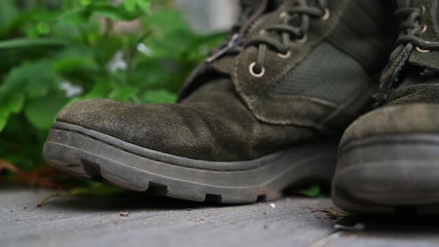 Worn Taiwanese Military Boots on Grass with Weathered Texture