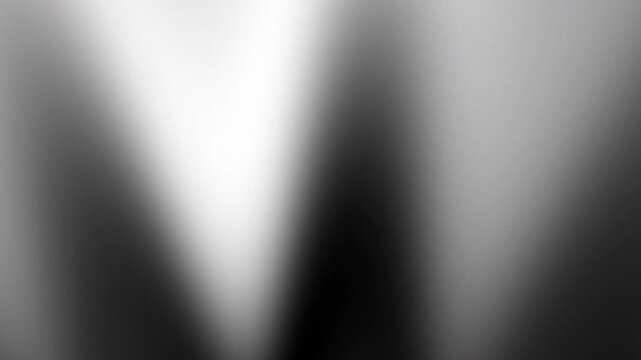 Blurred white light with dark gray shadows and black gradient contrast. Perfect backdrop for modern designs like websites and presentations.