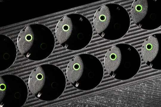 power filter extension cord on black wood background