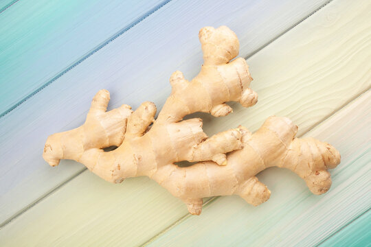 ginger on blue wood background top view