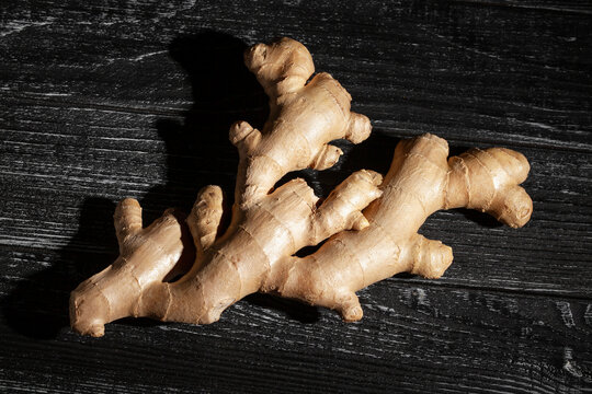 ginger on black wood background