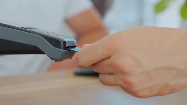 Customer Using Bank Card and POS Machine for Secure Payment