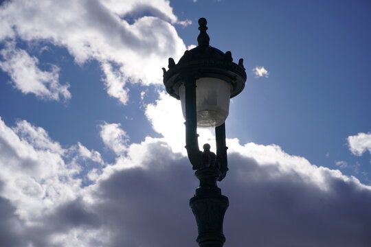 lamp post against blue sky