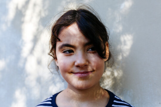 Smiling Preteen Girl Portrait in Natural Outdoor Light