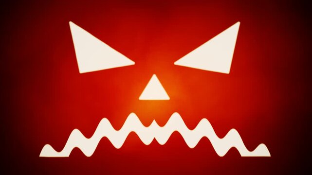 Halloween evil jack o lantern faces glowing on red backdrop