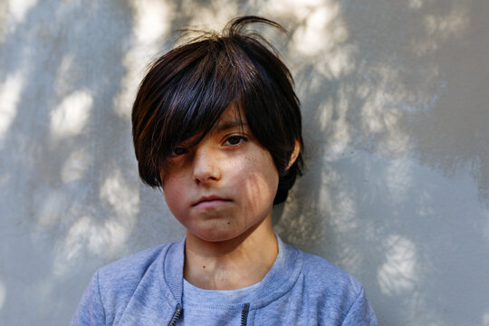 Portrait of a serious young girl outdoors
