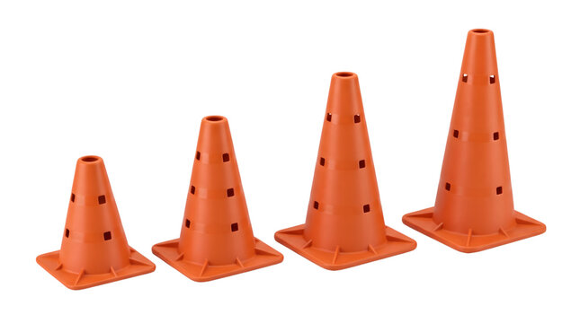 Four orange plastic safety cones in graduated sizes arranged from small to large for traffic and sports training drills.