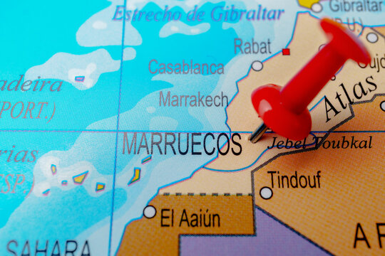 Morocco map, highlighted with a red pushpin indicating the travel destination. Focus on north africa geography