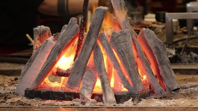 Glowing Charcoal Fire Burning in Traditional Robatayaki Grill Pit