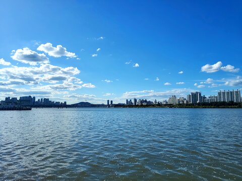 Panoramic view of Han River and N Seoul Tower under clear blue sky