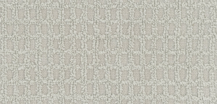 Square recesses interrupt the raised loops of gray terry fabric, a checked textile texture for scrapbook borders combining flatter woven pockets and soft pile beneath journal cover text