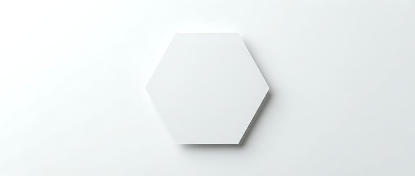 White hexagonal shape with soft shadow on neutral background