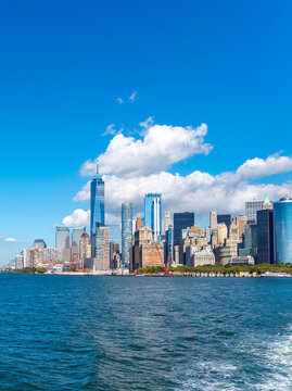 Vertical view of lower Manhattan skyline viewed from the water