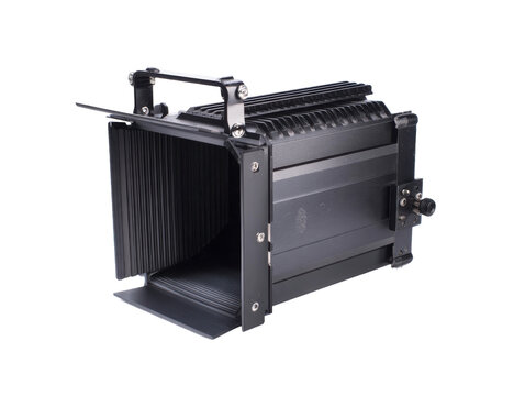 This adjustable light modifier features foldable barn doors and a sturdy handle for precise illumination control in photography and film production