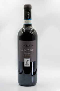 Caleo Nero d Avola Sicilia red wine closeup on white.