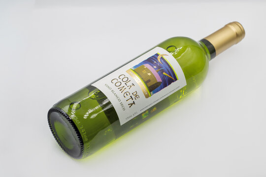 Cola de Cometa Spanish white wine bottle closeup on white.