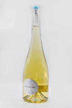 Blanc La Baume Languedoc French wine bottle closeup on white.