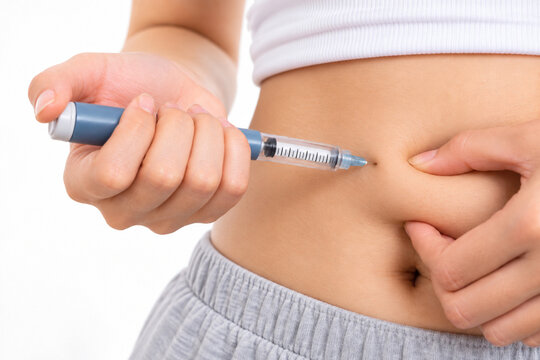 Close Up of Self Injection in Abdomen for Diabetes or Weight Loss Treatment