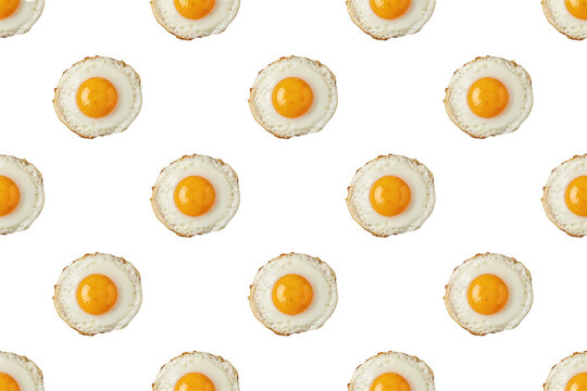 Seamless pattern of fried eggs with bright yellow yolks and white egg whites arranged on a plain white background, isolated on a, transparent