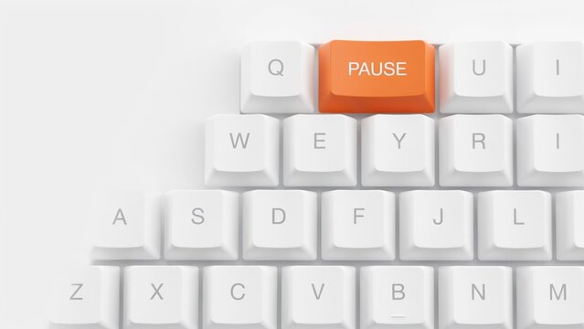Orange pause button on white mechanical keyboard, computer keypad with break key, digital wellness and work life balance concept