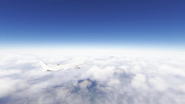 White airplane fly over mountain high above clouds and blue sky